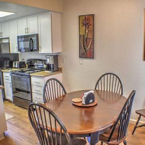 Model unit dining room and kitchen featuring modern finishes, and appliances